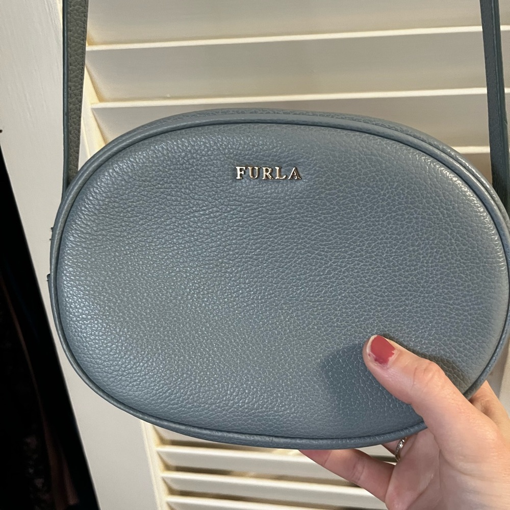 Light blue crossbody bag.